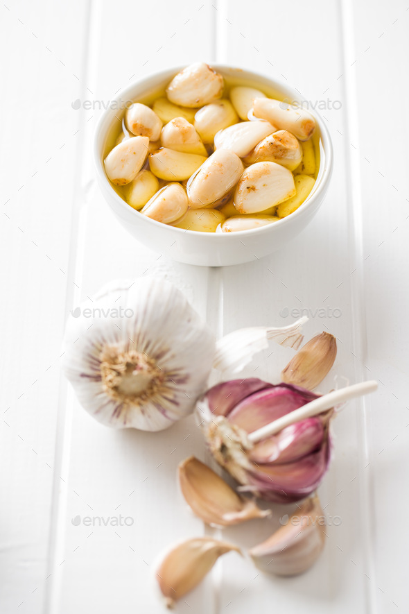 Marinated garlic. Pickled garlic. Stock Photo by jirkaejc PhotoDune